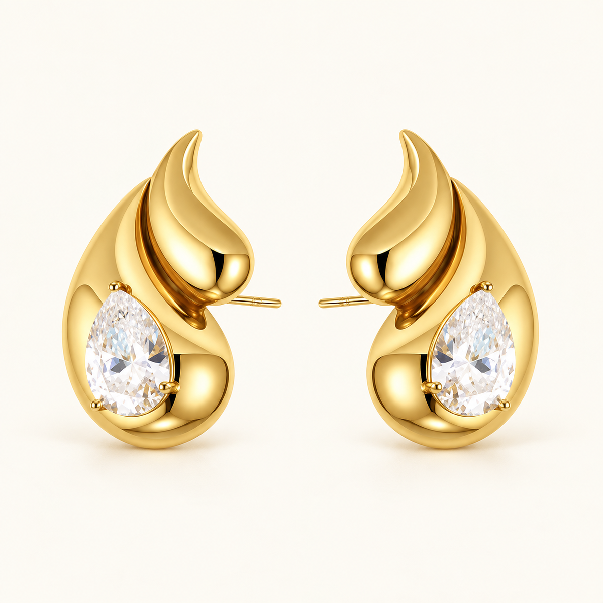 Atolea Earrings – sculptural gold earrings with pear-cut zircon