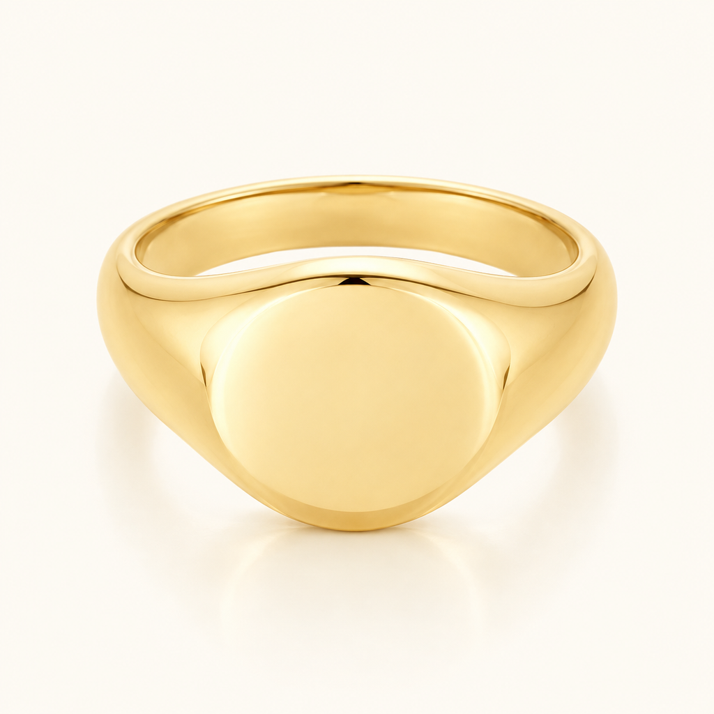 Everyday Signet Ring in polished gold with a smooth plain face on an ivory background