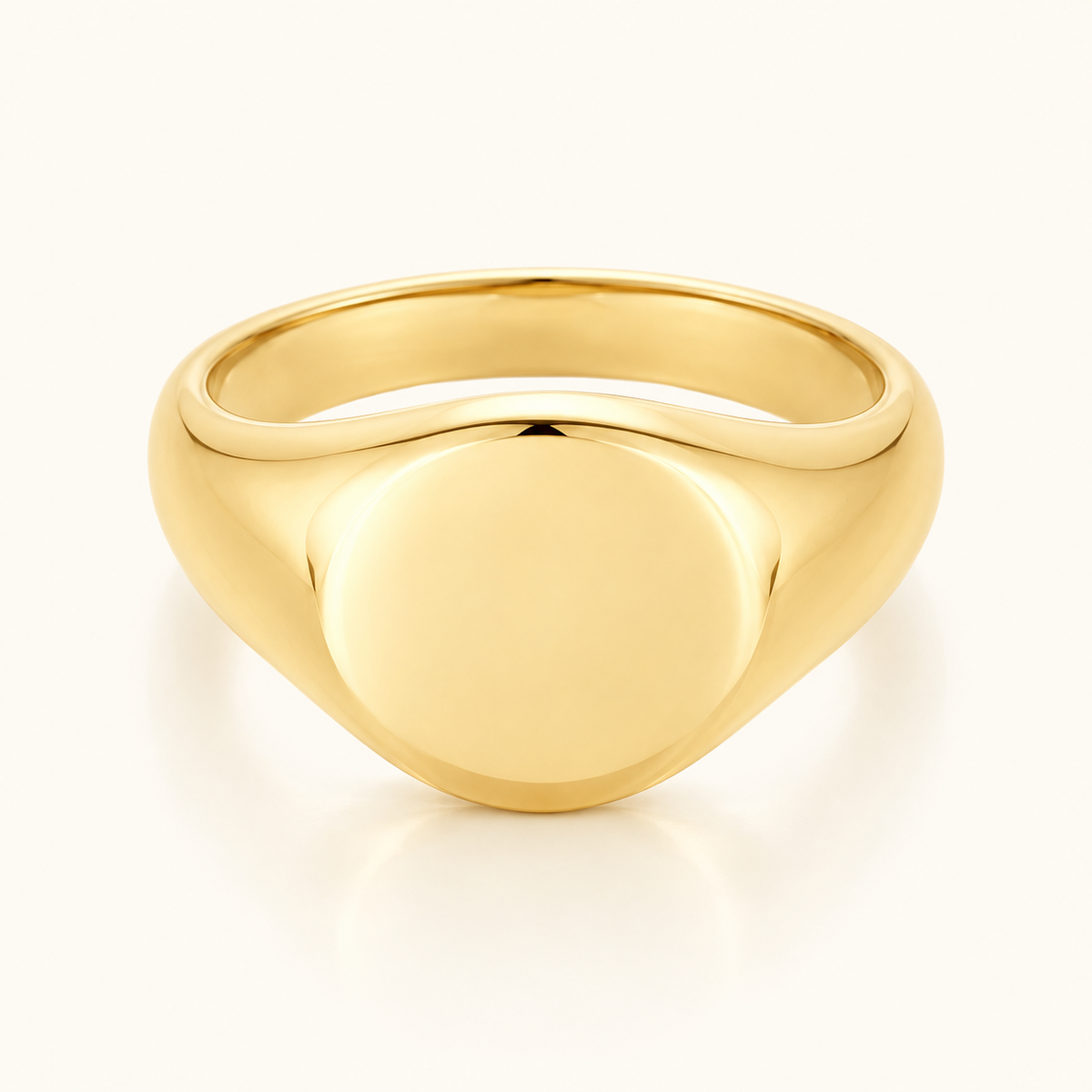 Everyday Signet Ring in polished gold with a smooth plain face on an ivory background