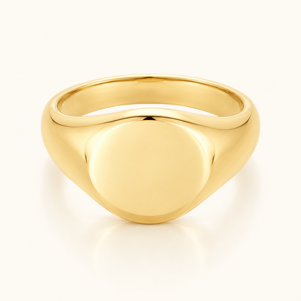 Everyday Signet Ring in polished gold with a smooth plain face on an ivory background