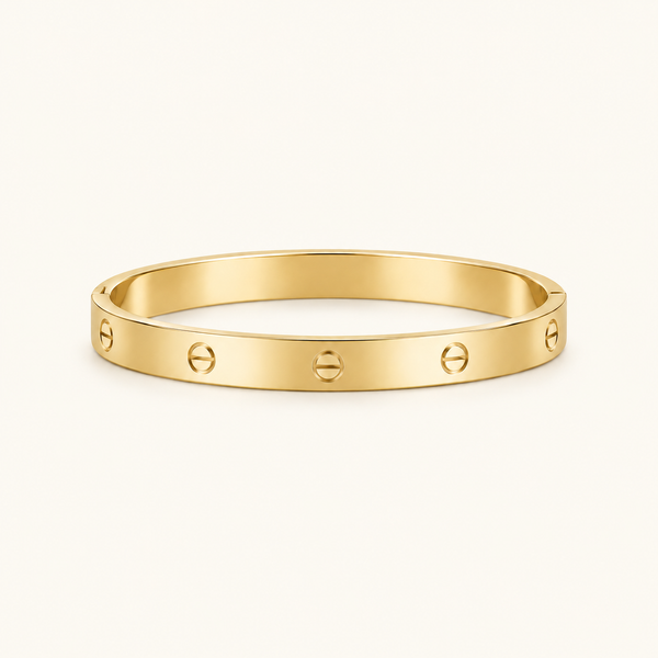 Plain Luxe Bangle in gold on warm ivory background