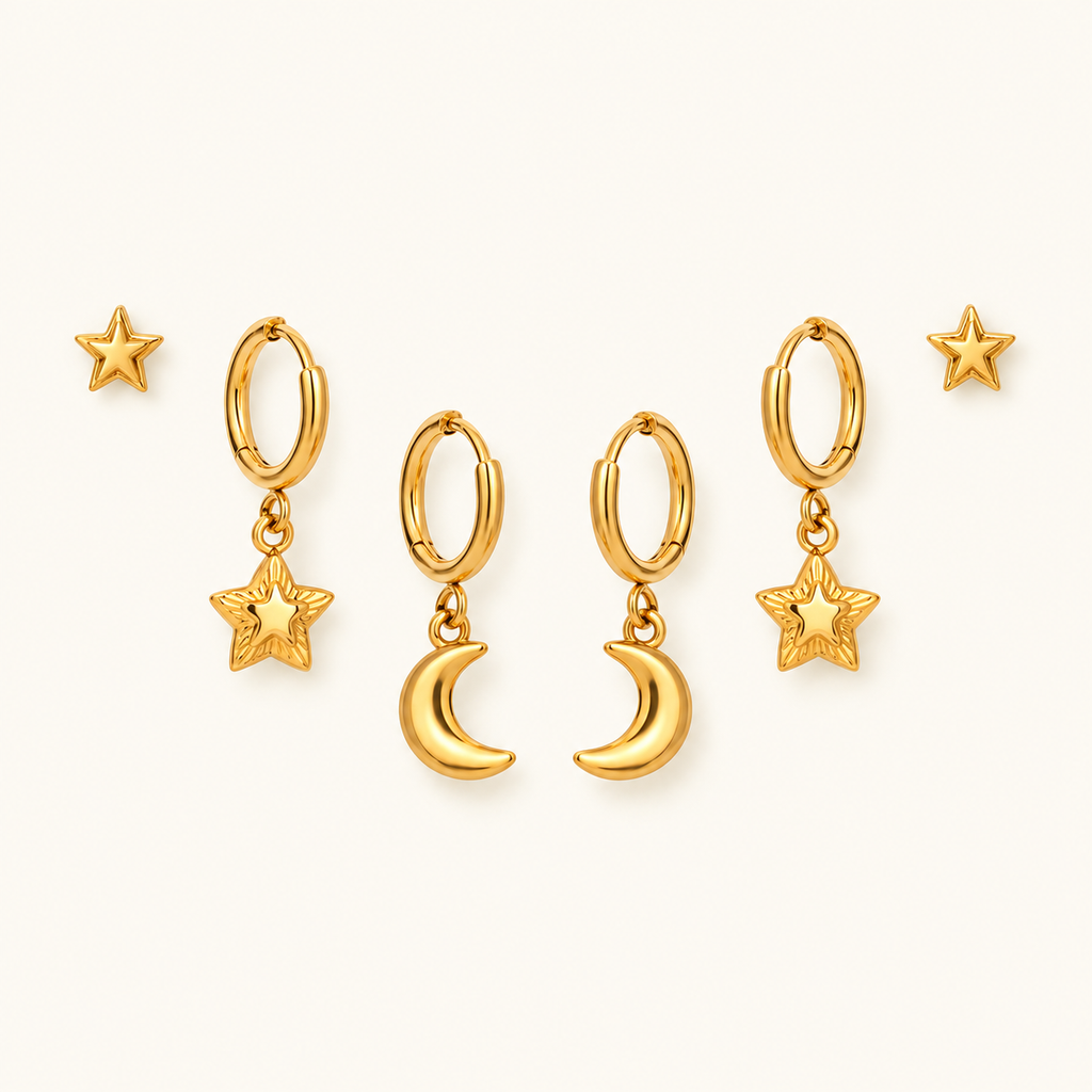 Star and Moon Earring Set in gold, symmetrically arranged on an ivory background