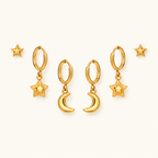 Star and Moon Earring Set in gold, symmetrically arranged on an ivory background