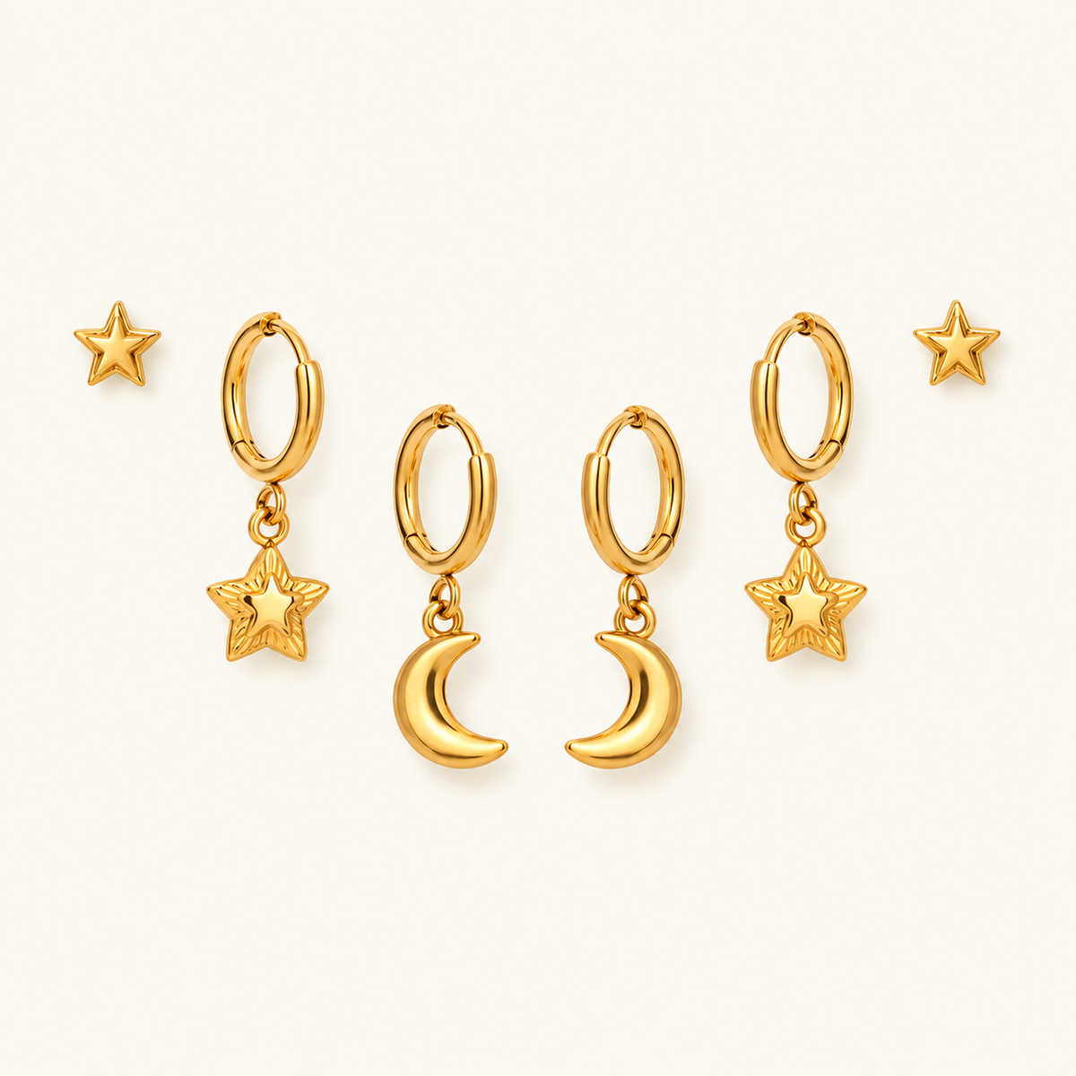 Star and Moon Earring Set in gold, symmetrically arranged on an ivory background