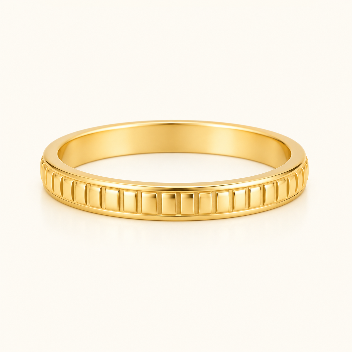 Gold-tone Textured Relief Ring with repeating ridged detailing, viewed from a low front angle