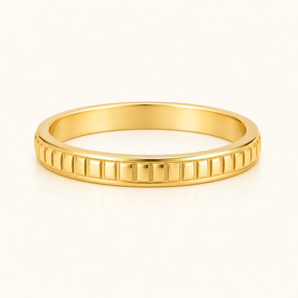 Gold-tone Textured Relief Ring with repeating ridged detailing, viewed from a low front angle