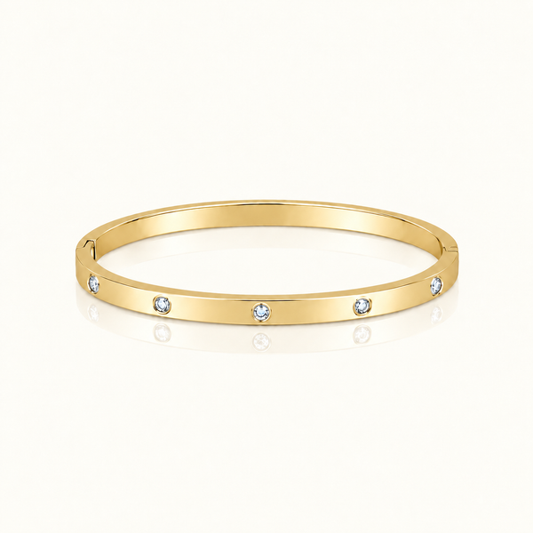 Thin Adorned Bangle in polished gold with five clear stones