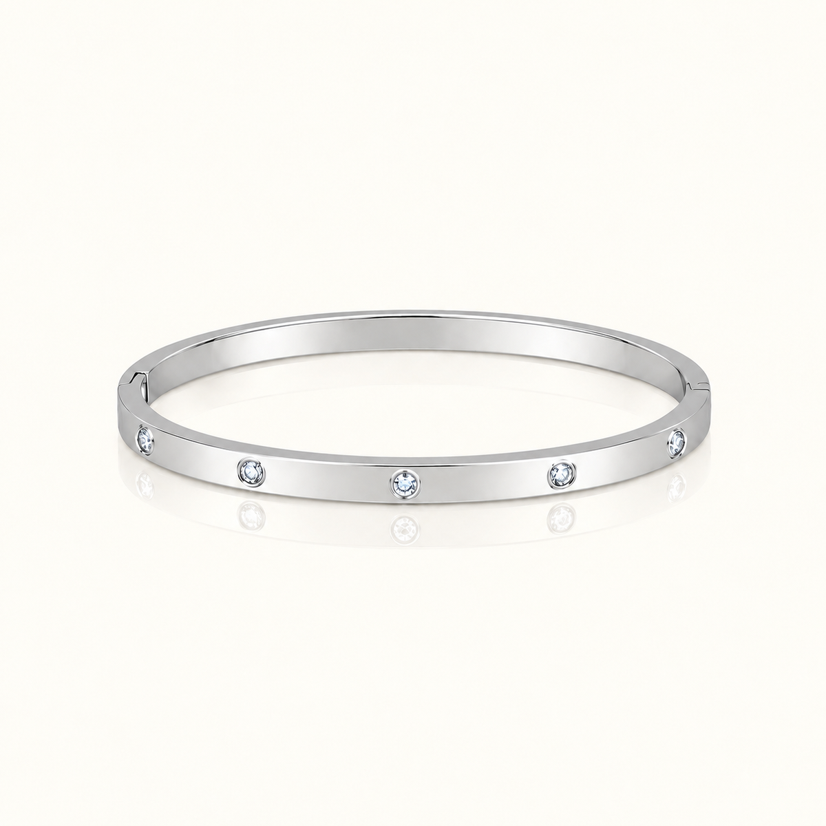 Thin Adorned Bangle in polished silver with five clear stones