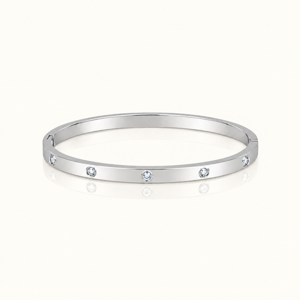 Thin Adorned Bangle in polished silver with five clear stones