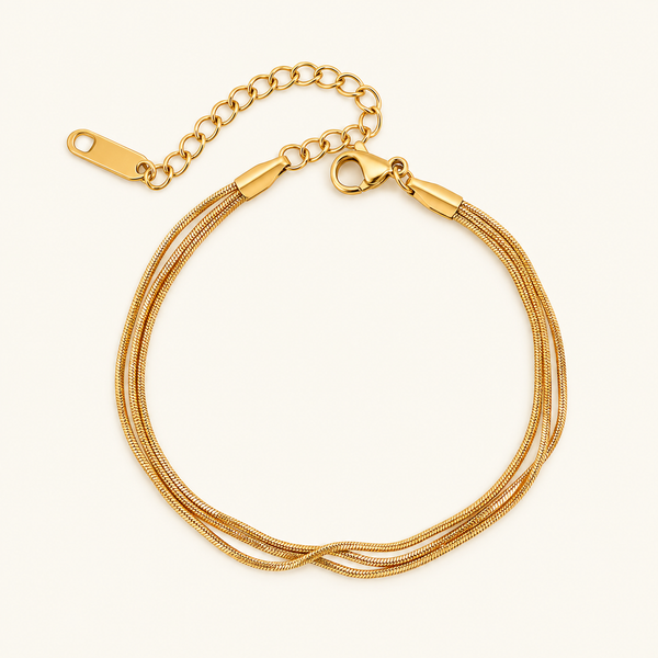 Triple layer bracelet with three fine gold-tone snake chains and an adjustable clasp
