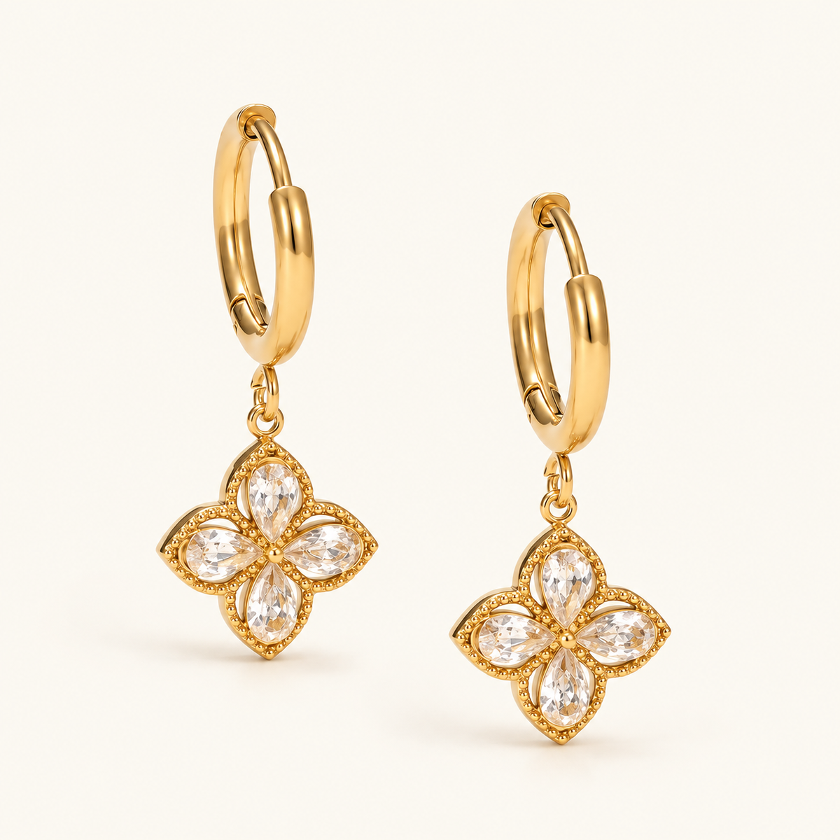 Zircon Wildflower Hoops with clear four-petal flower drops and gold-tone hoops