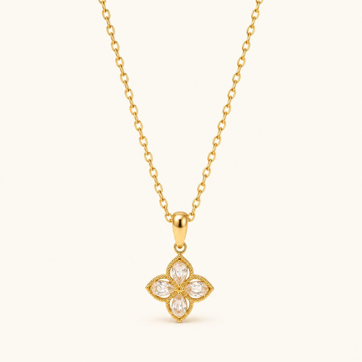 Zircon Wildflower Necklace with four clear petals pointing up, down, left and right on a fine gold-tone chain
