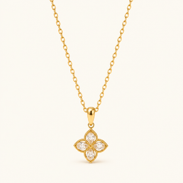 Zircon Wildflower Necklace with four clear petals pointing up, down, left and right on a fine gold-tone chain